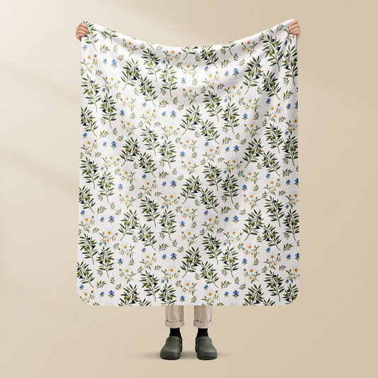 Plaid Oliveira Portugal en sherpa, tenu à la main, rameaux d'olivier et fleurs sur crème